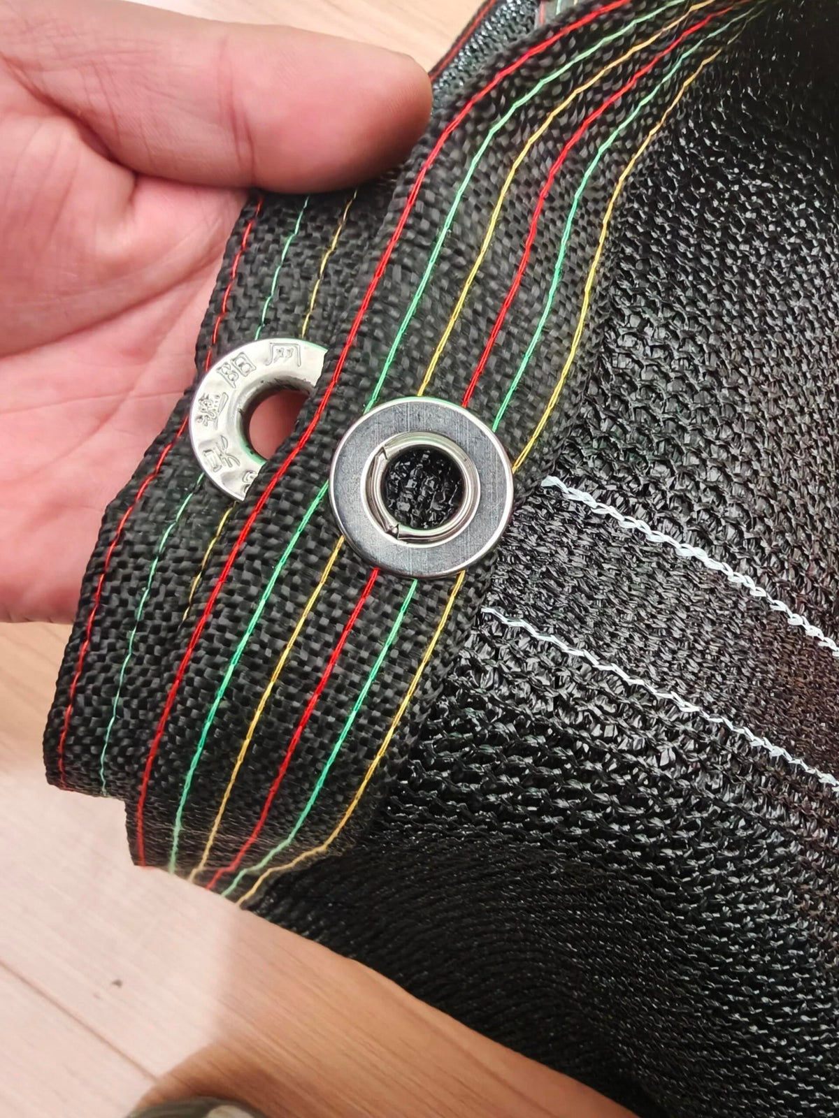 Reinforced edge and eyelet detail on agricultural shade net, supplied photograph