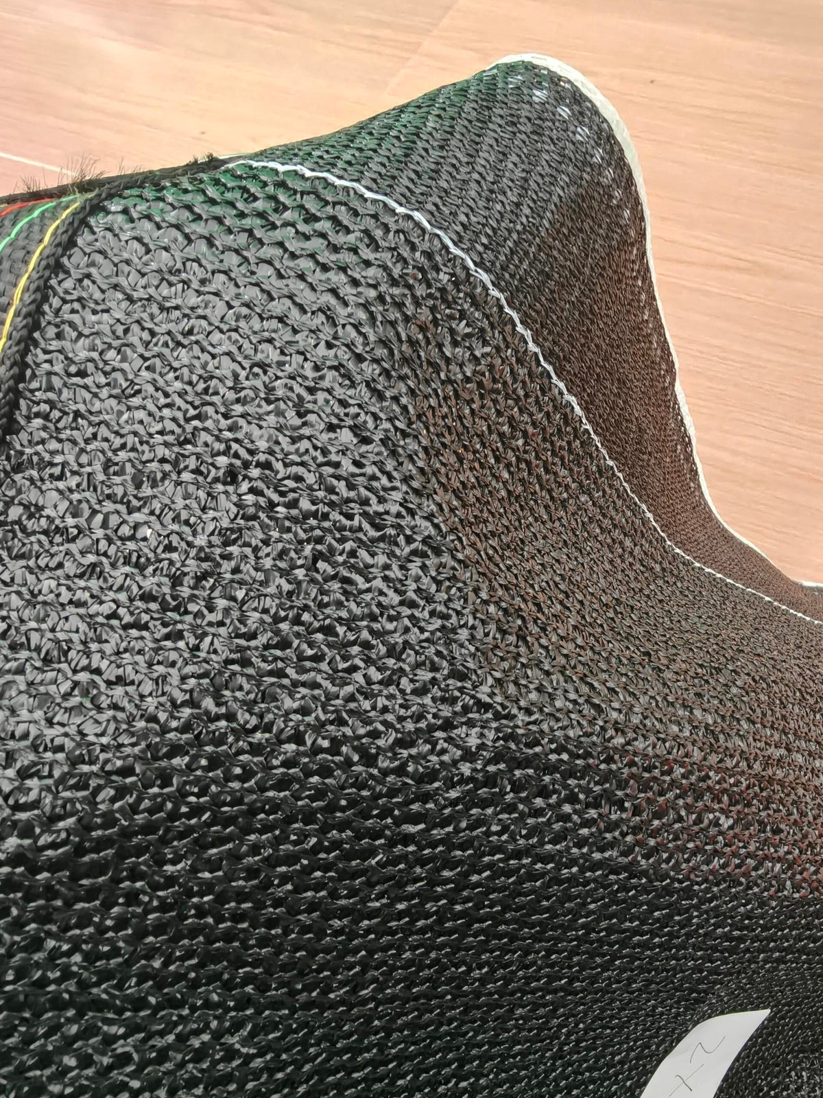 Close view of knitted shade-net material, supplied photograph