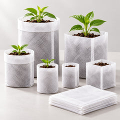 Illustrative open and folded white nursery bags; not a size-scale or mixed-size pack.