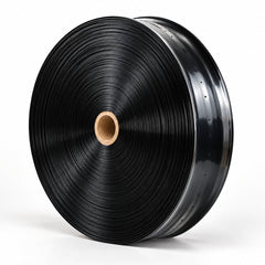Black PE micro-spray irrigation hose roll on a clean white background. Generated product illustration; one selected roll per purchase unit.
